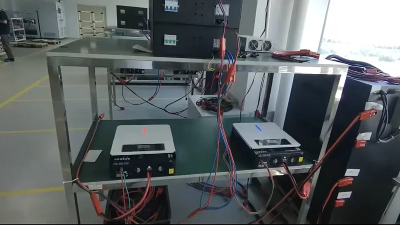 Inverter units connected with leads at a HOMESOL electrical test bench